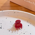 Mini handmade red hair claw clip with golden France lettering on a decorative tray - Burgundy