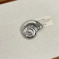 Close-up of a nautilus shell brooch with polished silver finish and spiral detail - 28 Silver Conch (Z-4112)
