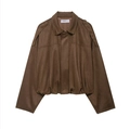 Gros plan sur la veste bomber en suédine marron avec fermeture éclair en métal - XS / Brun Foncé