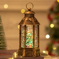 Vintage bronze Christmas lantern with glowing LED light and swirling snow effect - Tree with Gifts