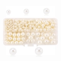 Detailed size comparison of multi-size white faux pearls in a clear storage organizer box - 10 Grids Faux Pearls