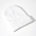Detailed close-up of a white ribbed knit beanie hat featuring a classic folded cuff design - White