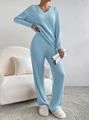 Detail of light blue V-neck knitted set with ribbed texture and wide-leg trousers - XS / Top And Bottom / Blue