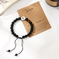 Handmade Scorpio beaded bracelet with zodiac charm on gift card with dried flowers - Scorpio