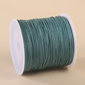 Grey-green 0.8mm nylon cord for handmade jewelry on white plastic spool - Malachite green