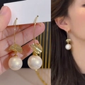 Elegant gold drop earrings with irregular metal plates and large pearls on model - 49# Ear Hook-Gold-Round