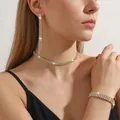 Detail of elegant gold-tone necklace, long fringe earrings, and bracelet set with rhinestones - DZ125-Gold 2-Row Necklace 3-Piece Set