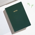 Portable A6 dark green notebook with gold NOTES engraving and soft leather cover - Coal Green