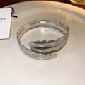 Silver feather cuff bracelet with intricate engraved textures in an adjustable open style - Silver Feather Shape Style