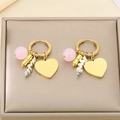 Detail of gold hoop earrings featuring pink beads and heart pendants on luxury base - Pink Bead Big Heart Style (KE118738-SP)