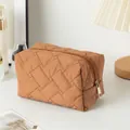 Brown quilted makeup bag with metallic zipper and soft texture for travel storage - Irregular Quilted Dark Coffee