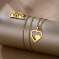 Golden stainless steel heart jewelry set with necklace and stud earrings on display - Nested Heart (TZ-448)