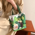 Canvas handbag in cream white featuring green mountain print and cute April bear motif - Forest Bear