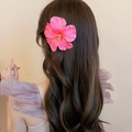 Detailed back view of a pink hibiscus flower hair clip styled on wavy brunette hair - 18# Duckbill Clip - Pink Hibiscus Style