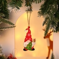 Wooden Christmas gnome ornament with red hat and small tree, hanging on snow pine branch - Style 1 (Gnome with Tree)