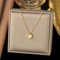 Gold layered heart pendant necklace with shell inlay displayed on a beige jewelry box - AH6048 White Heart Mother of Pearl Gold