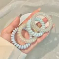 Set of 4 pastel spiral telephone cord hair ties in light blue and matte white - 12# Blue Radiant (4pcs Bag)