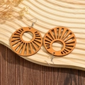 Brown wooden geometric sunburst earrings with hollow design on wave wood tray - Khaki
