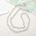 Detail of silver metal chain with white pearls and lobster clasps on phone lanyard - 8mm Silver Artificial Pearl Chain