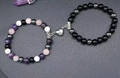 Pink jade and turquoise magnetic heart couple bracelets on a textured background - Six-color Beads & Frosted Black With Heart Pendant