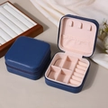 Portable blue PU leather jewelry box with pink velvet lining and multi-slot interior storage - Dark Blue