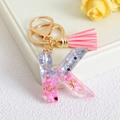 Pink letter K glitter resin keychain with matching pink tassel and gold metal hardware - Letter K / Pink