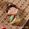 Tang Dynasty girl figurine in green hanfu holding objects on a calligraphy background - Chess Girl Fridge Magnet