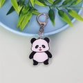 Cute cartoon panda acrylic keychain with bamboo leaves on a blue tray background - Panda