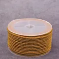 Roll of earth yellow 2mm braided pineapple cord for DIY jewelry and necklaces - Earthy Yellow