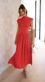 Detail of red sleeveless midi dress featuring high neck and stylish waist cut-outs - Red