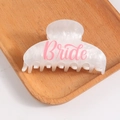 White marble texture hair claw clip with pink Bride lettering on a wooden tray - White Marble with Pink Text
