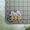 Detailed size measurement of resin flower fence charm showing 3.5cm width on a ruler - Purple Flower Fence