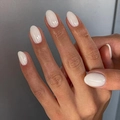 Glossy milky white almond press-on nails shown on hands with natural finish - Jelly Glue Type / White Style (LHSD-30)
