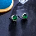 Detailed close-up of crown-set green zircon stud earrings with silver metal finish - Deep Emerald Green 8MM