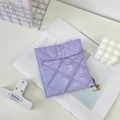 Close-up of lavender quilted mini pouch with glossy finish and blue heart-shaped button - Light Purple