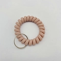 Matte skin pink spiral phone cord wristband with durable silver metal keychain ring - Light Pink