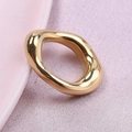 Irregular golden 304 stainless steel ring on soft pink satin fabric background - Gold