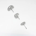 Macro shot of three polished silver metallic stud earrings with liquid drip geometric design - 3-Piece Stud Earring Set / Silver