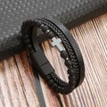 Close-up of men's leather stone bracelet with silver cross and matte magnetic clasp - Black + Volcanic Stone