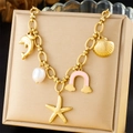 Gold stainless steel bracelet with dolphin shell starfish pearls and rainbow charms - Ocean Rainbow Pearl Style (N3319)