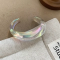 Close-up of iridescent C-shaped resin bracelet on beige cotton bag with modern minimal style - Iridescent Round Minimalist Bangle