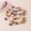 Close-up of mini matte flower hair claws in muted colors like beige, brown and pink - Little Pumpkin Green / Bulk Packaging / Mixed Milk Coffee Colors