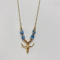 Detailed close-up of golden bull skull pendant with blue and white stone beads - Bull Skull - Blue Stone