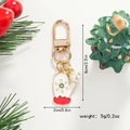 Detail of Christmas glove keychain in red and white enamel with faux pearl and dimensions - Christmas Mittens