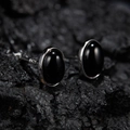 Close-up of oval S925 sterling silver stud earrings with black jasper on volcanic stone - Natural Black Agate Oval Silver 5*7mm