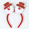 Detail of Christmas headband featuring festive plush Santa Claus figures with red hats - G4-3 Sequin Luminous Double Santa Claus