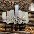Macro detail of Bohemian moon crystal hair comb with iridescent stones and moon emblem - Colorful White Crystal Black Wire Silver Moon