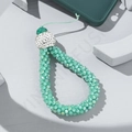 Close-up of light green beaded phone wrist strap with white rhinestone detail on white background - Light Green