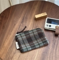 Close-up of retro plaid fabric coin purse with simple wish label on a wooden desk - Green and Coffee Plaid Tweed