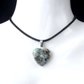Natural heart-shaped stone pendant necklace with grey speckled texture and black cord - Tianshan Blue